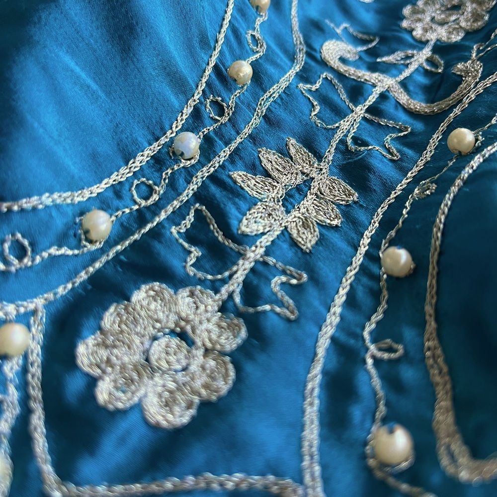 Peacock blue silky skirt with silver and pearls stitching made in India